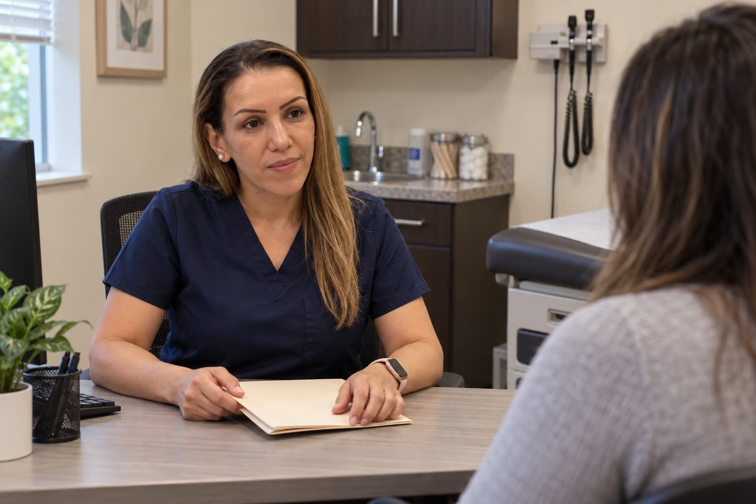 Zeinab Arafat going through results with a patient